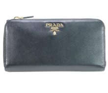 Prada Saffiano round zip wallet